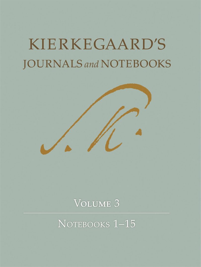 Photograph of an open journal and pen used for planning daily habits in morning light.