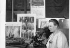 A scientist working with a microscope in a laboratory