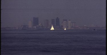 a city skyline seen through hazy air