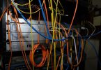 rows of network cables in a mining server room