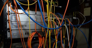 rows of network cables in a mining server room