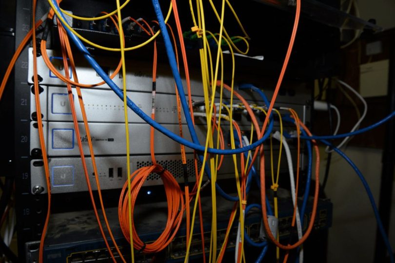 rows of network cables in a mining server room